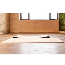 Load image into Gallery viewer, Cork exercise mat next to another mat in a yoga studio